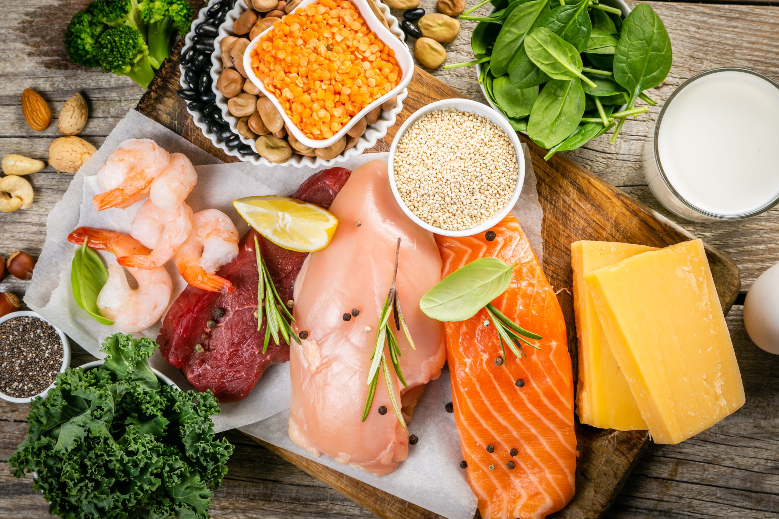 Selection of animal and plant protein sources on wood background